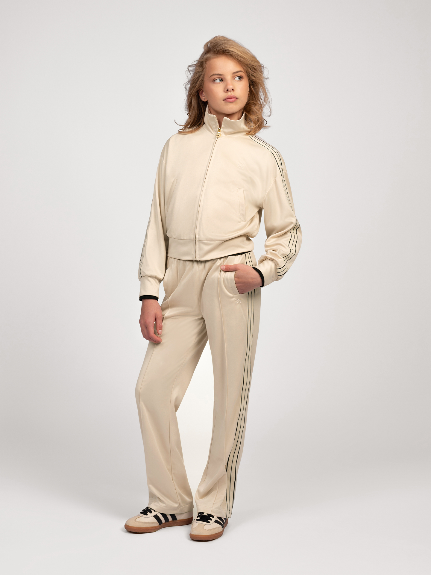 Track pants with striped piping