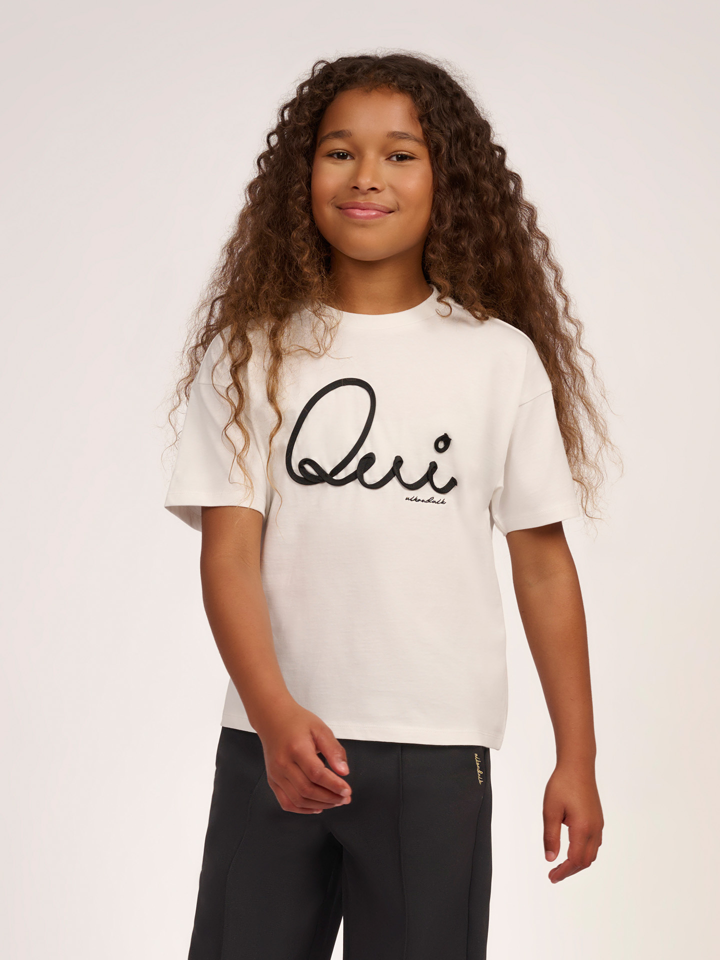 T-shirt with embroidered text