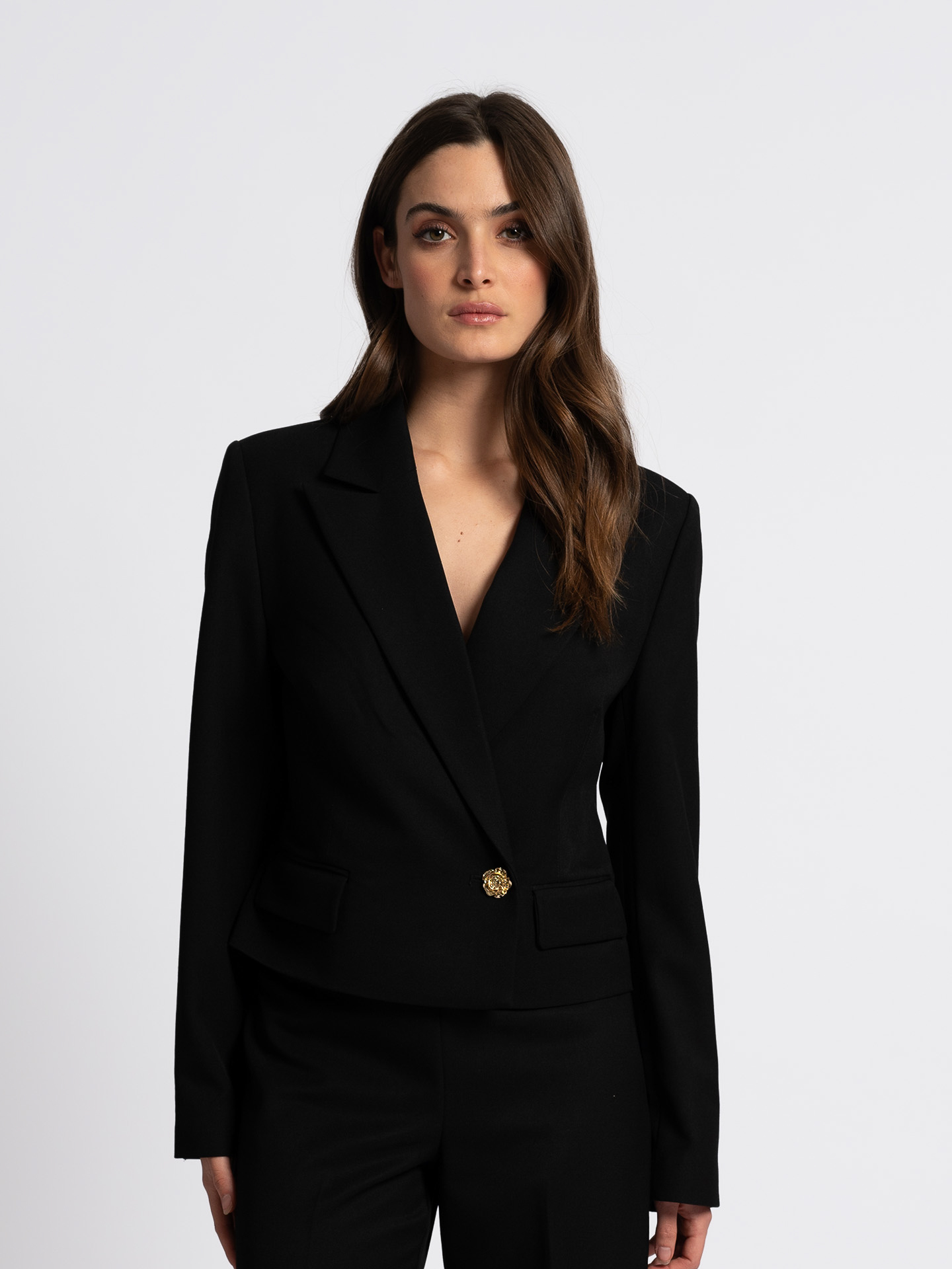 Blazer with flower-shaped button