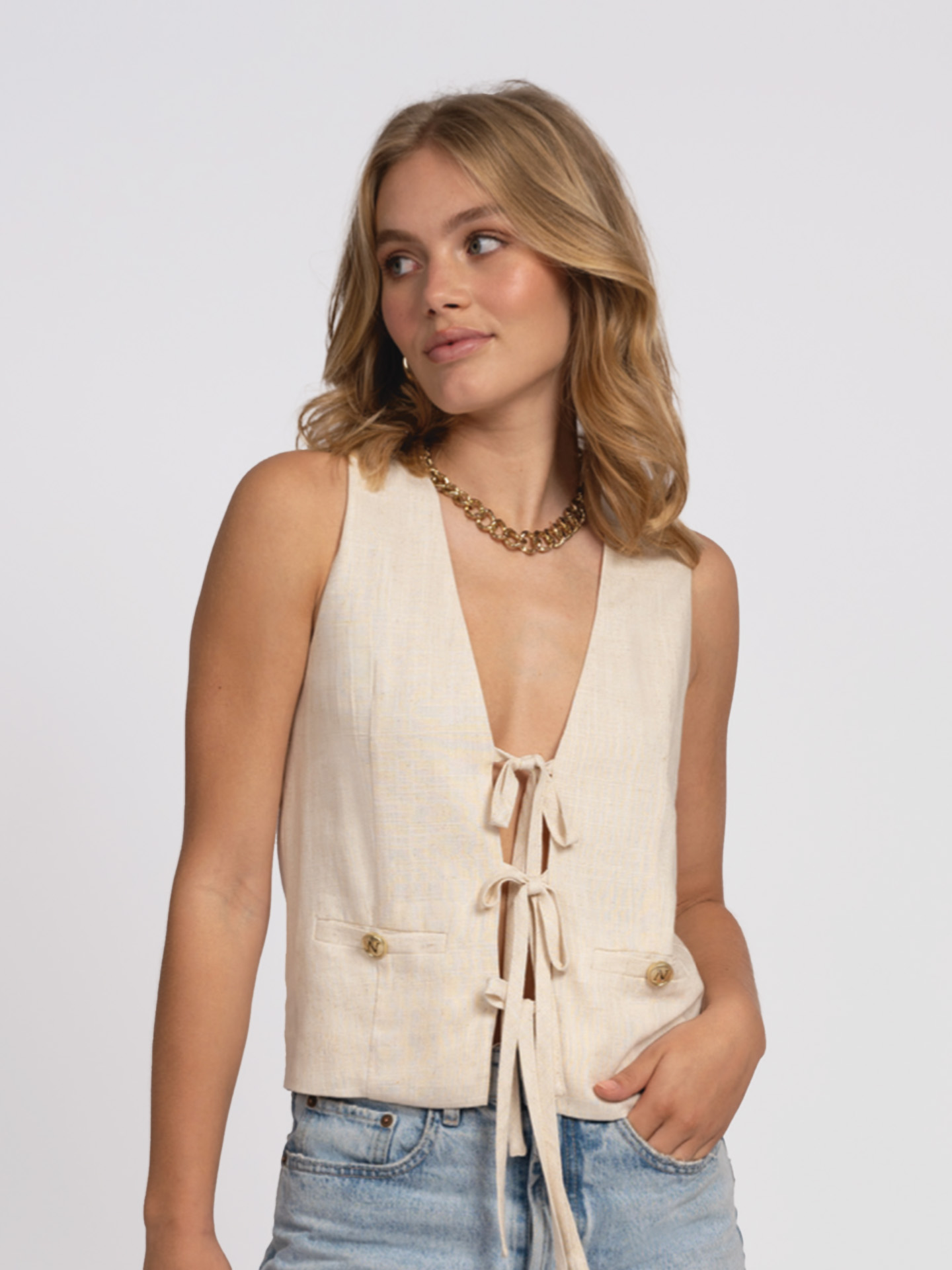 Mixed waistcoat with bow details