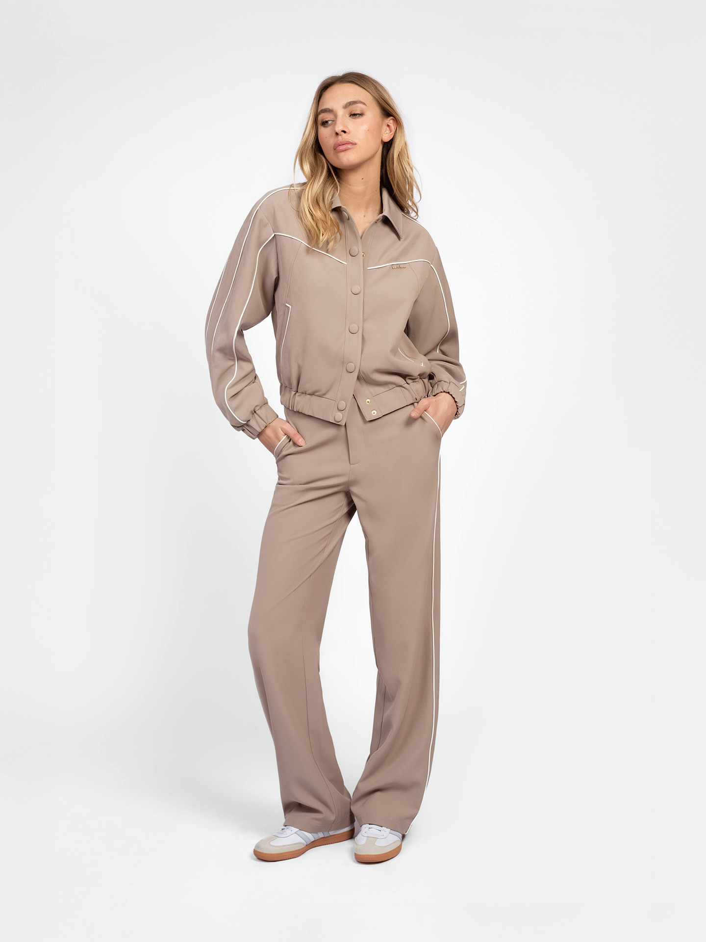 Trousers with white piping