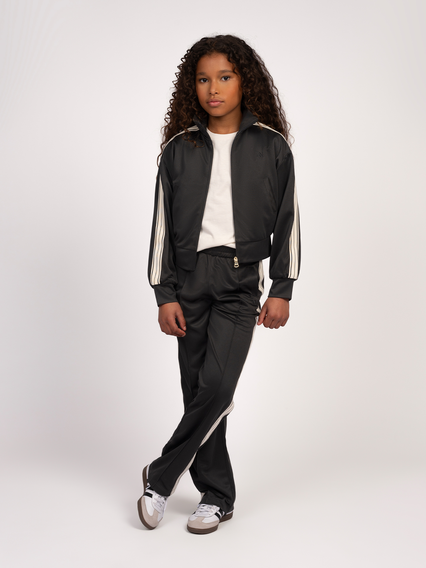 Track pants with striped piping