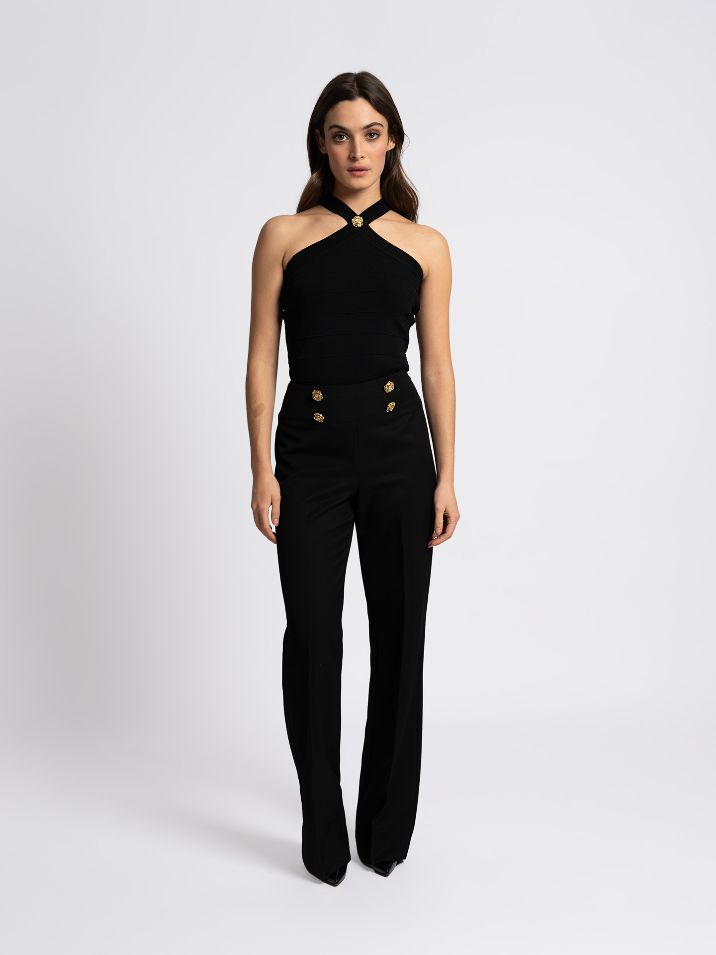 Trousers with flower-shaped button details