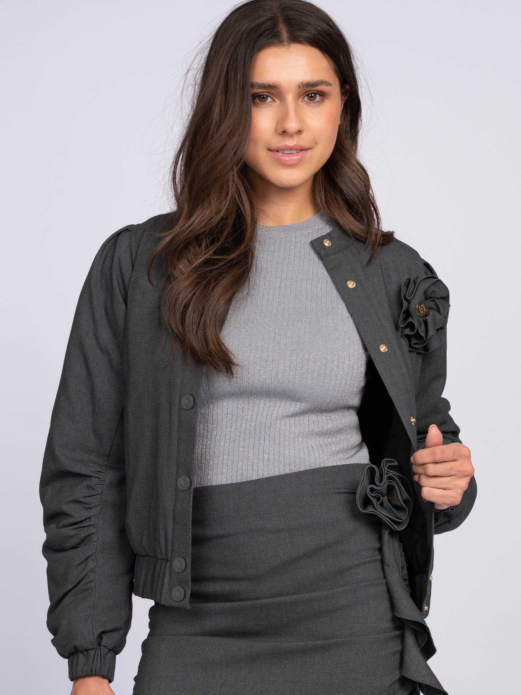 Loose-fitting jacket with decorative flower